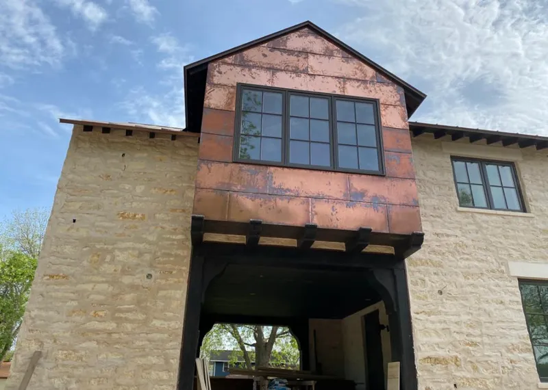 Copper metal panel facade on a stone building for Roof Repair in North Lauderdale