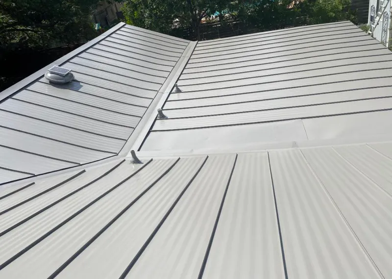Solar attic fan installed on a metal roof for Roof Ventilation in North Lauderdale
