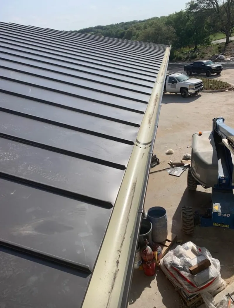 Standing seam panel and gutter detail on a metal roofing jobsite in North Lauderdale